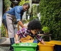 African Descent Kid Separating Recyclable Trash Royalty Free Stock Photo