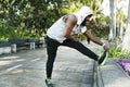 African descent man stretching at the park