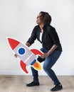 African descent woman holding rocketship icon