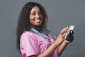 An African doctor consults a patient, makes a video call from a webcam on the tablet screen. Telemedicine videoconference remote Royalty Free Stock Photo