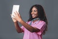 An African doctor consults a patient, makes a video call from a webcam on the tablet screen. Telemedicine videoconference remote Royalty Free Stock Photo