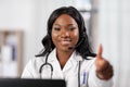 African doctor with headset and laptop at hospital Royalty Free Stock Photo