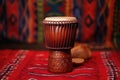 african drum djembe against tribal background