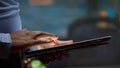 African employee using tablet standing in living room late Royalty Free Stock Photo