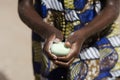 African ethnicity black boy washing hands outdoors with water