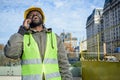 African ethnicity engineer man very happy smiling out loud outdoors talking on the phone Royalty Free Stock Photo