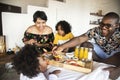 African family having breakfast in bed Royalty Free Stock Photo