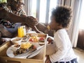 African family having breakfast in bed Royalty Free Stock Photo