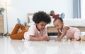 African family, little boy and cute toddler baby girl, brother and sister have fun playing model toys and wooden blocks together Royalty Free Stock Photo