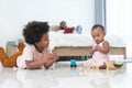 African family, little boy and cute toddler baby girl, brother and sister have fun playing model toys and wooden blocks together Royalty Free Stock Photo