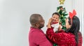 African family, 4-month-old Nigerian baby newborn son, father and mother smiling and happy together Royalty Free Stock Photo