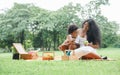 African family mother and little son picnic together at green park. Royalty Free Stock Photo