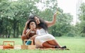 African family mother and little son picnic together at green park. Royalty Free Stock Photo