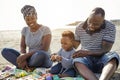 African family playing on the beach in summer vacation - Love and summer concept - Focus on kid face