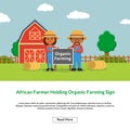 African farmer holding organic farming sign