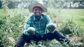 African farmer holding a watermelon in organic farm.Agriculture or cultivation concept Royalty Free Stock Photo