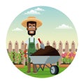 african farmer man straw hat wheelbarrow earth garden fence