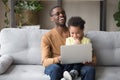 African father and cute kid son having fun with computer Royalty Free Stock Photo