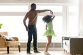 African father holding hand of child daughter dancing with princess Royalty Free Stock Photo