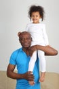 African father holding on the shoulder of his daughter Royalty Free Stock Photo