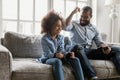 African father little daughter holding joypads competing in playstation game