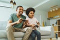 African Father and son playing console games Royalty Free Stock Photo