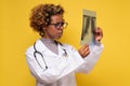 African female doctor looking at a lungs or torso xray