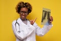 African female doctor looking at a lungs or torso xray