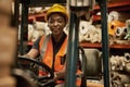 African female forklift operator working in a warehouse Royalty Free Stock Photo