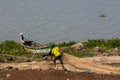 African fisher man on the lake shore near boat