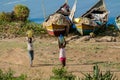 African fisherman boat and children at lake shore