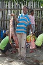 African fisherman and catfish