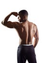 African fit man showing biceps, beautiful body Royalty Free Stock Photo