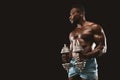 African fitness model doing workout with dumbbells Royalty Free Stock Photo