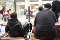 African-French people sitting and waitting train at Gare de Paris-Est