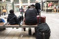 African-French people sitting and waitting train at Gare de Paris-Est