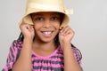African Girl being silly with hat Royalty Free Stock Photo