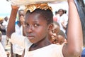 African girl with a bowl full of fish, Ghana