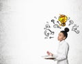 African girl with notebook with question marks and light bulb