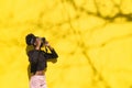 African girl photographer making picture in street