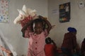 African girl playing with a doll in rural Swaziland, Africa