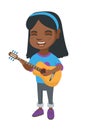 African girl singing and playing acoustic guitar. Royalty Free Stock Photo