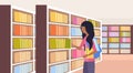 African girl student choosing books schoolgirl near bookshelves modern library interior reading education knowledge Royalty Free Stock Photo