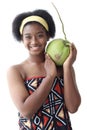 African girl teen with curly hair wearing traditional clothes, holding tropical coconut fruit. Happy smiling African woman Royalty Free Stock Photo