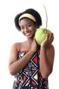 African girl teen with curly hair wearing traditional clothes, holding tropical coconut fruit. Happy smiling African woman Royalty Free Stock Photo