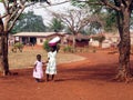 African girls with bucket on the head Royalty Free Stock Photo