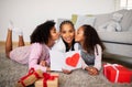 African Girls Kissing Mom Congratulating Her On Mother& x27;s Day Indoor Royalty Free Stock Photo