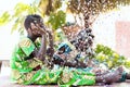 African Girls with Typical Clothing Celebrating Life with Confetti in Bamako, Mali