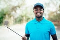 African golfer standing in golf course Royalty Free Stock Photo