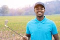 African golfer standing in golf course Royalty Free Stock Photo